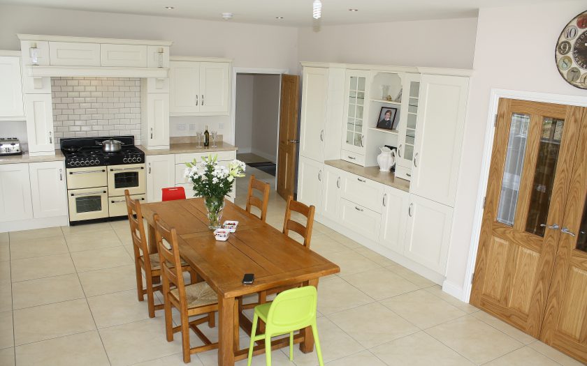 brown kitchen design with dining table